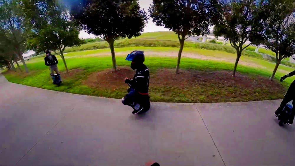 Riders crossing an open park on the 4 Park Run.