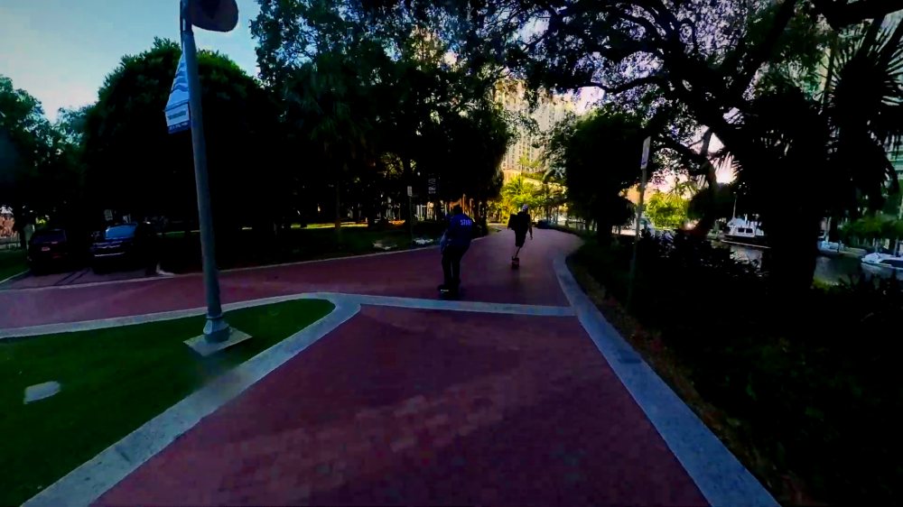 Riders setting off on a shaded park path on a Monday evening.