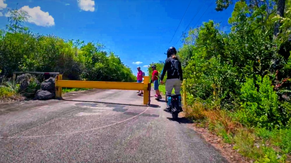 Riders setting off at the gate on an Everglades access road.