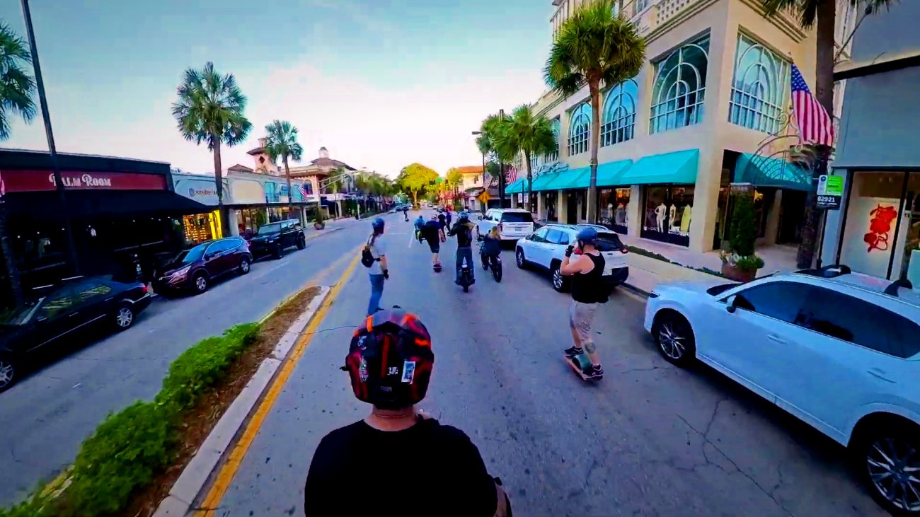 The group moving down a main street together.